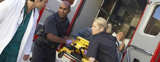 paramedics-and-doctor-unloading-patient-from-ambulance