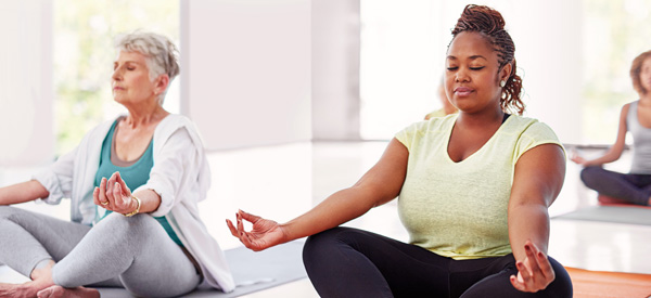 A group completes a breathing exercise