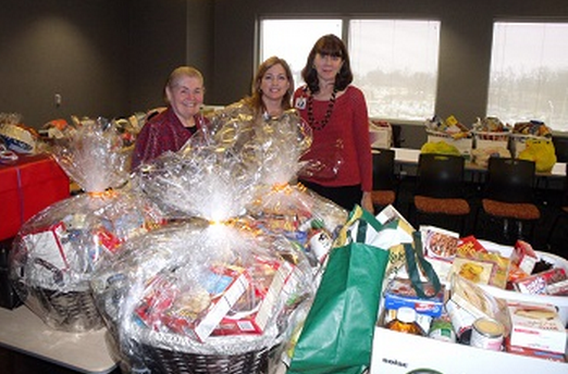 Employees Donate Food Baskets To Families In Need For Thanksgiving