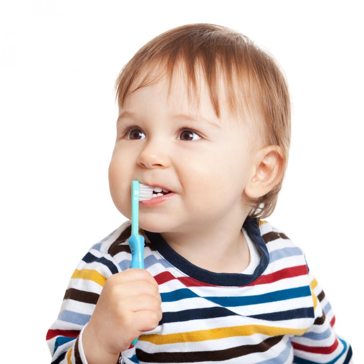 Newborn Brushing His Teeth