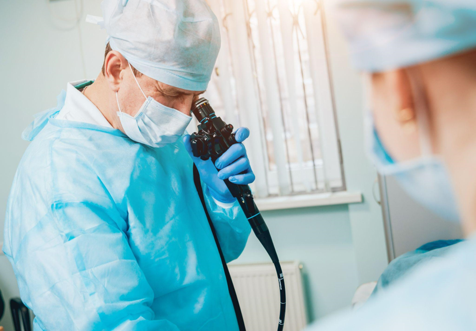 Doctor holding endoscope before gastroscopy. Medical examination