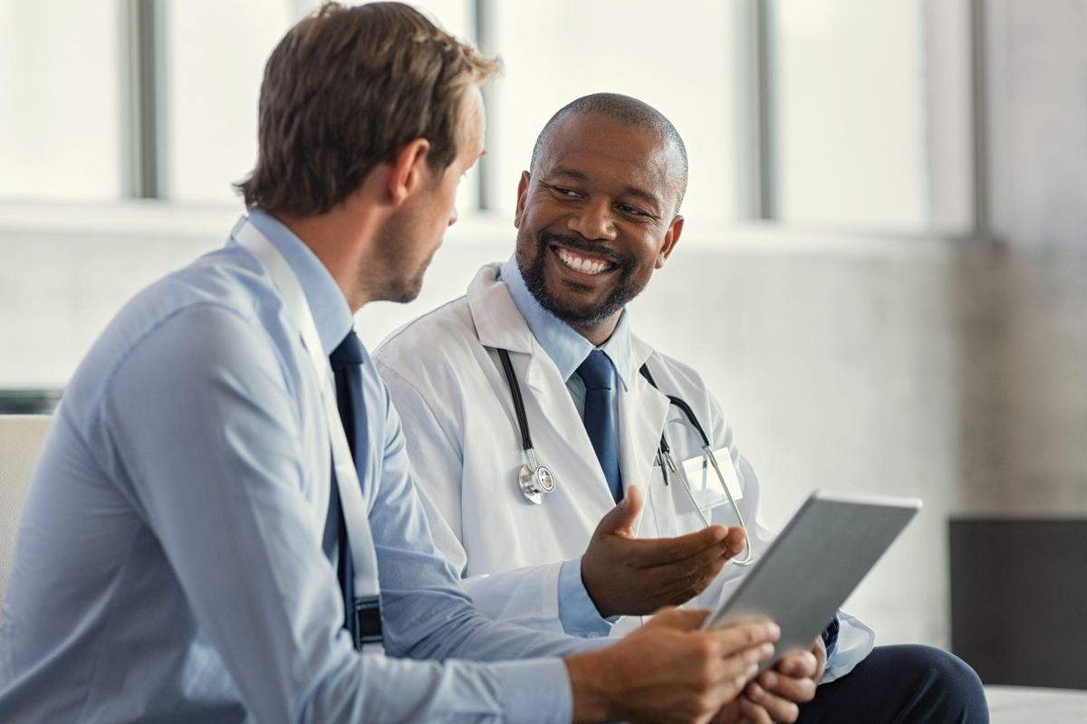 multiethnic specialist doctors discussing case