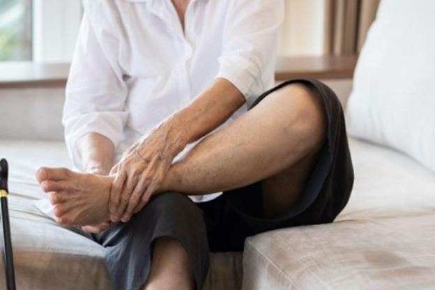 Leg pain of senior woman at home, healthcare problem of senior concept