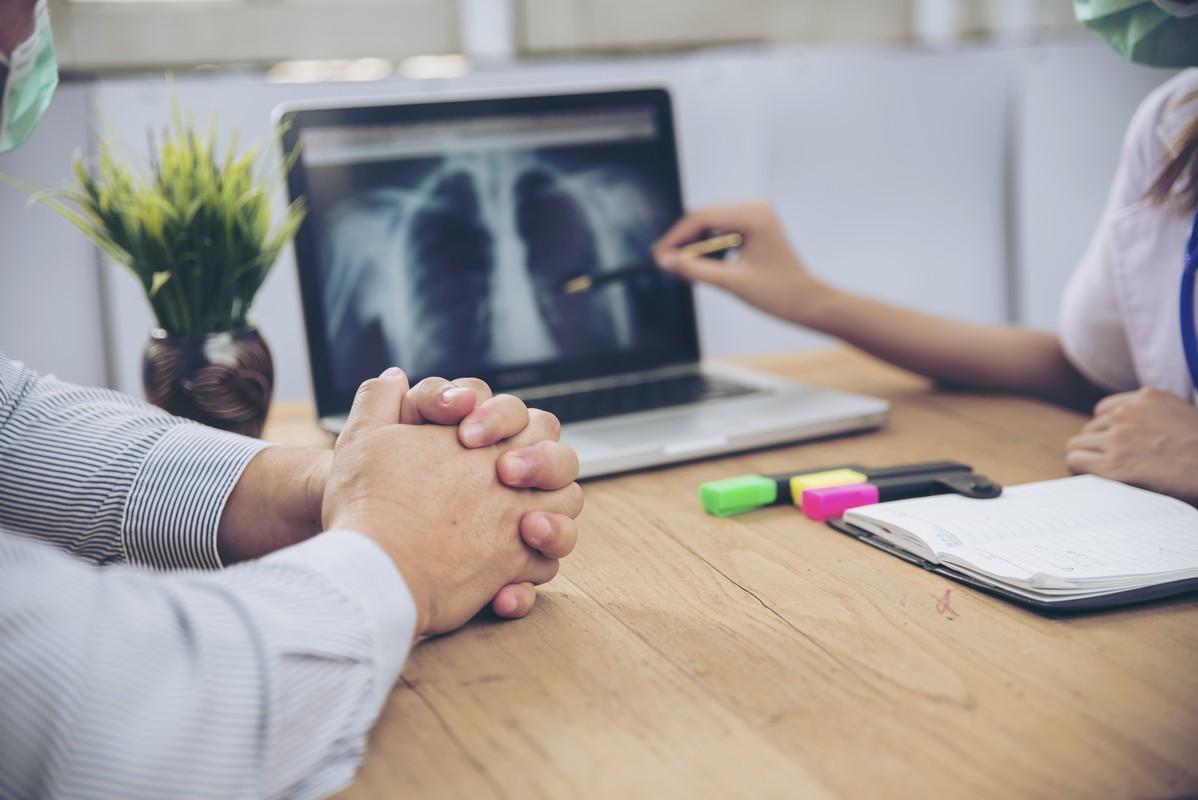 patients are listening x-ray scan results from professional doctor