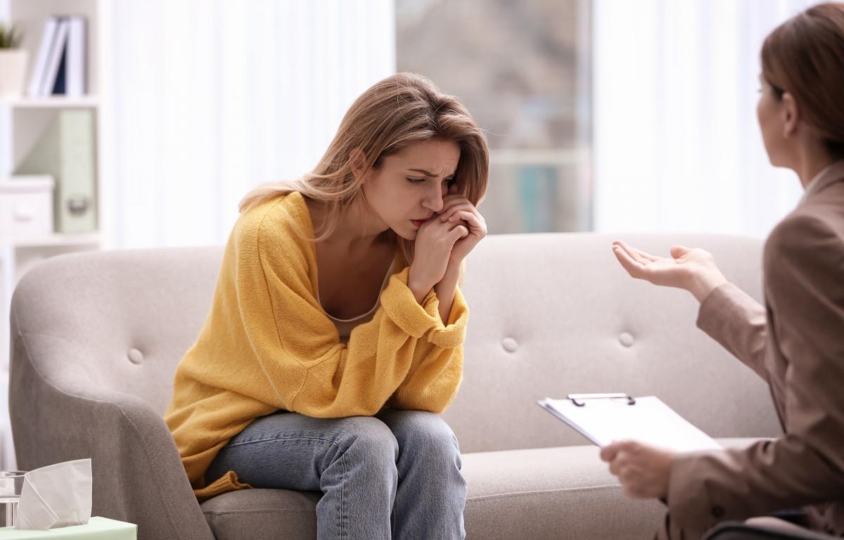 Psychotherapist working with young woman