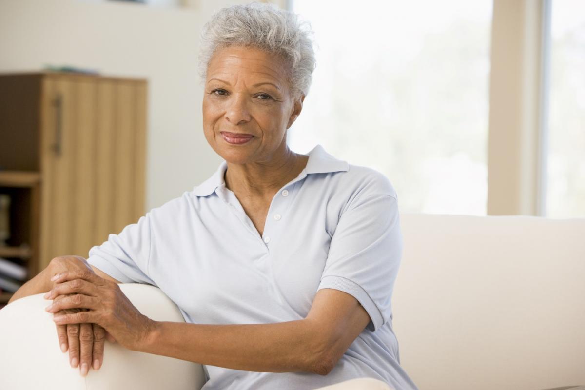 senior woman sitting in living room