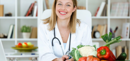 beautiful-smiling-nutritionist-looking-at-camera