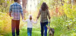 family-walking-in-woods