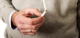 male-hand-with-broken-cigarette