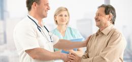 smiling-doctor-shaking-hands-with-happy-patient.