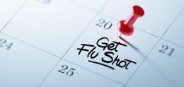 the-words-get-flu-shot-written-on-calendar-with-a-red-push-pin