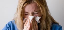 woman-blowing-her-nose-hard