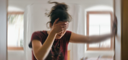 Blured photo of a woman suffering from vertigo or dizziness or other health problem of brain