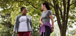 two women walking outdoors