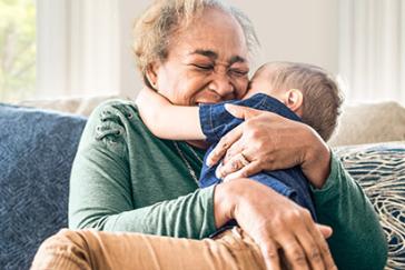 older woman and child hugging