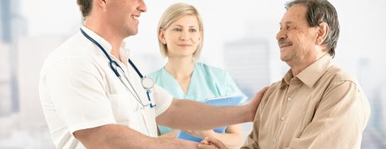 smiling-doctor-shaking-hands-with-happy-patient.