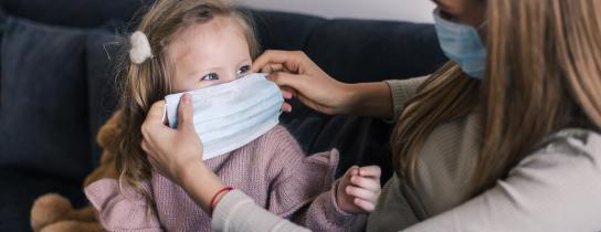 child and parent / caregiver with surgical masks