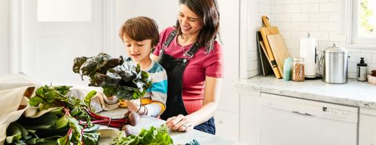 Parent and child preparing a healthy meal
