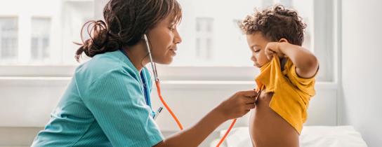 A young patient is examined by a provider