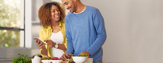man and woman in kitchen