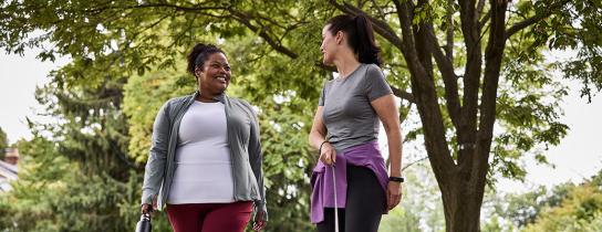 two women walking outdoors