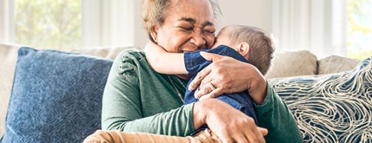 older woman and child hugging