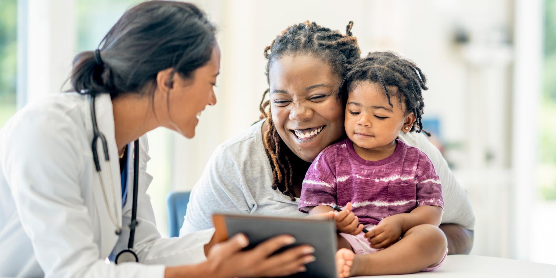 doctor with mother and child