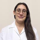 A photo of Marissa Mutzek, PA-C smiling in a lab coat